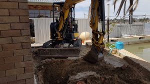 Excavating for pile cap heads